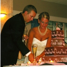 Brent and Melissa cut the cake