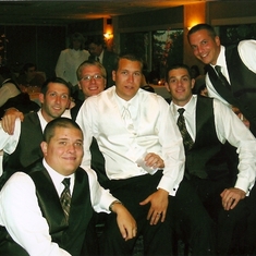 The guys pose for a picture at the wedding