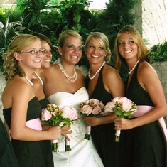 Melissa and her sisters at her wedding