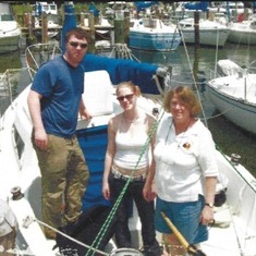 Brian, Diana, Dale on  sailboat in Herrington Harbor which we shared with the Walshes -- about 2012