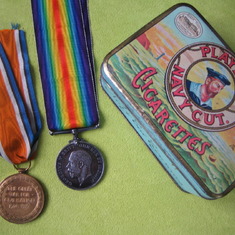 His Dad's WW1 medals with an old tin cigarette box he had kept.