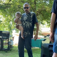 Pawpaw holding Bubba lubb at last years birthday party