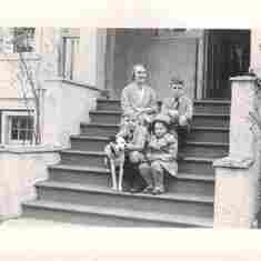 Phyllis Brian brother John Sister Helen and Techy the family dog sitting on the steps of 1218 Bidwel