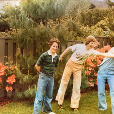 Farrell backyard with Dave, Bruce and Iranian exchange student Siyomac - circa ~1975.  Being the best athlete, Bruce of course swiped the frisbee.  I didn't even try.