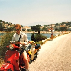 Corfu Greece -  Bruce is either lost or reading the New Yorker like he was prone to do.  He also had no idea how to drive a Vespa