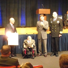 receiving award at ceremony at the Pentagon