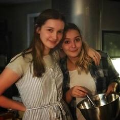 Anne and Eva, cooking Mom dinner in 2017 in our home in Acton, MA, where we lived in the woods from 2012 to 2019. Acton Schools rounded these girls out nicely.