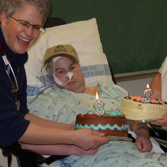 Bryce Birthday spent in Hospital, February 4, 2003.  Bryce was very ill in this time, ended up spending 2 years at Harborview Hospital  Nurse Katie has the Cake