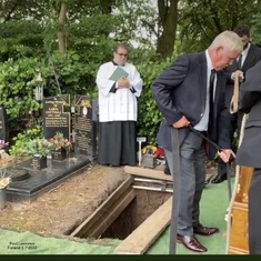Kevin laying Paul  into his final resting place  