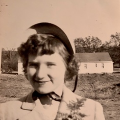 A young Camille with a corsage.