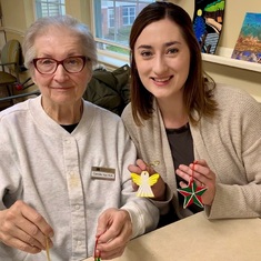 Camille and granddaughter Celeste showing off their painted Christmas ornaments!