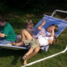 Gareth, Sarah, Sophia and Cam playing in hammock 8 July 2007