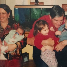 Thanksgiving 1999. Shirley holding Abby and Caleb. Carl holding Rebekah and Jacob.