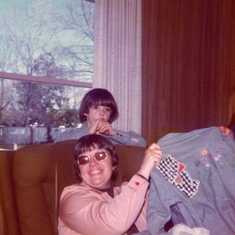 Gertrude appliqued the shirt for Carol; Jeff in background
