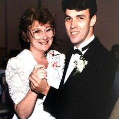 Carole dancing with her son Martin Jr's wedding to Victoria in 1990.
