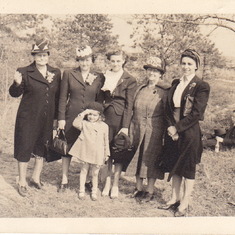 Carole as a girl with (Left to Right): Minnie Wachter (Lou's mother), Lou (Wachter) Coleman, Evelyn (Nordhorn) Flanagan, Anna (Ostertag) Behrens, May (Nordhorn) Coleman    - Background: Johnny Gardiner....a friend of the family