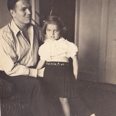 Photo of Carole with her father, Hall.  On the back of the photo was a note from Carole to her brother Hall "Mom & I thought you look just like Pop in these pictures, don't you?  I asked Pop if he's what I have to look forward to!"