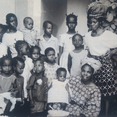 My birthday with Mummy Aduke carrying me,  my Mummy behind, Morenike wearing black, and other kids.