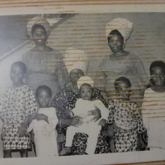 Mama carrying Folabi, standing Morenike, Kike, Seyi, Dele, behind Mummy Bisi and Mummy Caroline!