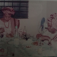 Mummy Caroline eating with sister Ambassador during sister's 60th Birthday in Nigerian Embassy, Central African Republic.