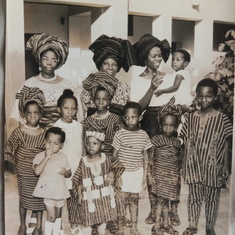 Mum Caro, Mama, Mum Bisi carrying Dayo; dressed traditionally Seyi, Folabi, Morenix, Kike, Dele