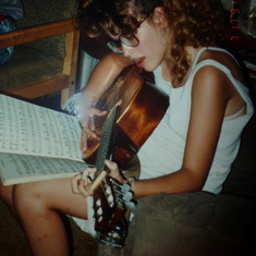In her teenage years playing the guitar just like her dad!