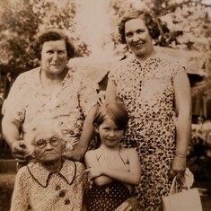 Young Carolyn with mom and older relatives.