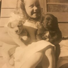 Care loved and adored puppies. She owned many over the years.