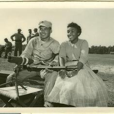 Rita visits Albert at the rifle range.