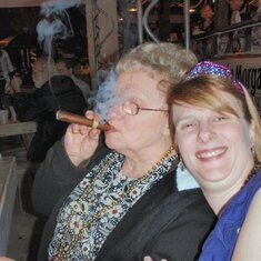 Mom was a regular visitor to Tampa, where she was much beloved by my friends. Here she shares a stogie with some of my coworkers at my after-work birthday party.