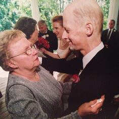September 21, 2002: On my wedding day with Ross, Mom was choked up most of the time. Here she shares some more words of wisdom with my groom.