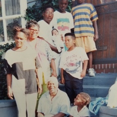 Granny chilling on the steps with her son Cheddie, daughters Judy and Gill and some of her grands.