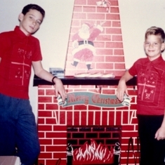 Charlie and Chris, when younger inside the apt during the holidays. Clara got them both matching shirts, as was her custom.