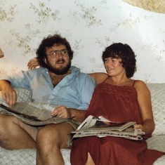 Chuck and Debbie reading the newspaper