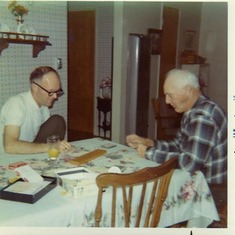 Chuck & his dad William "Bill" Stelling & a cribbage board