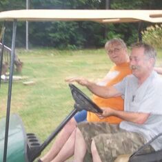 He loved this golf cart! ;] They had a back full of children. LOL