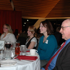 Charlie surrounded by his kids at annual scholarship dinner