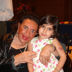 Mimi and Maiya Ponsky at a large passover dinner.