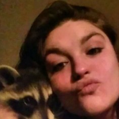 Chelsea's raccoon that she had found abandoned from its parents and raised it till it got big enough to be on his own.