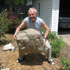 Triumphant fake rock boulder lift.  In the back yard garden!
