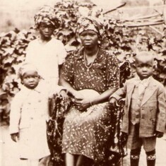 At age 5 (standing front right of picture) with Mother