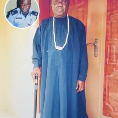 Daddy in his tradition attire. Insert photo of him in his police uniform.