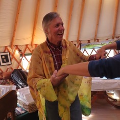 Chip trying on silk cape and dancing at Artists Along the Bitterroot Show 2019