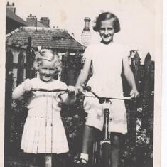 Christine on her bike with cousin Anne. At Christine's home in Bonnybridge.