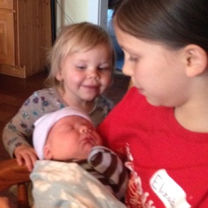 New baby Justin,  March 2016. with his 2 sisters admiring him.