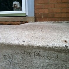 Chris signed my front porch.  Angie stands watch.