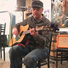 Chris playing an open mic at Spangalang Brewing in 5Points in December 2019