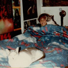 Chris in his bed with Jeremy & Hercules