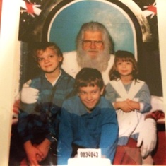 Santa with Chris on the left, brother Kenny in the center and Sister Laura on the right