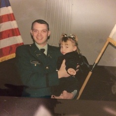 Officer commissioning day. Holding Alexa His Niece. She was a tot at the time.